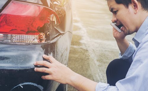 Man is calling insurrance company for claiming his car crash damaged on road accident